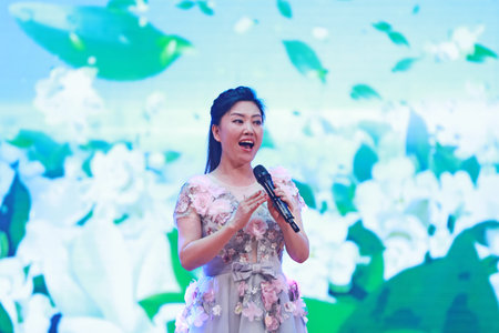 Luannan County, China-August 15, 2019: Female singing on stage, Luannan County, Hebei Province,...
