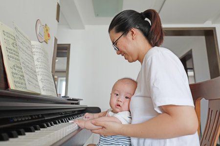 Luannan County, China-September 14, 2019: A baby plays in bed, Luannan County, Hebei Province, Chinaのeditorial素材