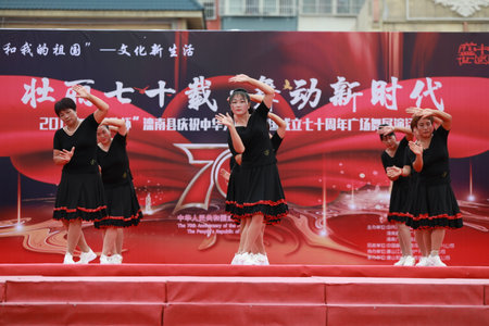 Luannan County, China-August 20, 2019: Ladies are dancing fitness in the square, Luannan County, Hebei Province, Chinaのeditorial素材