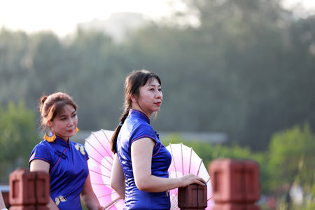 Luannan County, China-August 27, 2019: Chinese Cheongsam Walking Show in the Park, Luannan County, Hebei Province, Chinaのeditorial素材