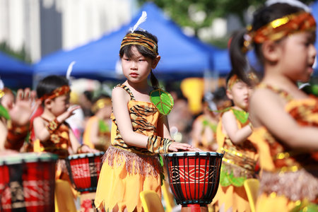 Luannan County-May 31, 2019: Children are playing African drums to celebrate International Children's Day, Luannan County, Hebei Province, Chinaのeditorial素材