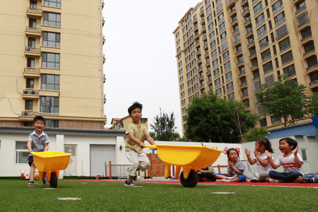 Luannan County-May 30, 2019: Kindergarten children play games to celebrate the upcoming 61 International Children's Day, Luannan County, Hebei Province, Chinaのeditorial素材