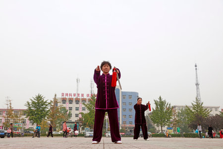 LUANNAN COUNTY, China-October 15, 2017: Taiji Sword performance in the square, LUANNAN COUNTY, Hebei Province, Chinaのeditorial素材