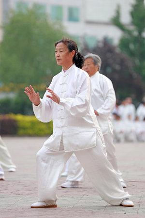 Luannan County-May 19, 2019: people doing traditional Tai Chi Chuan in the park for healthy, traditional Chinese martial arts concept, Luannan County, Hebei Province, Chinaのeditorial素材