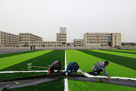 LUANNAN COUNTY-Oct. 15, 2018: Artificial lawn laying site in a sports field, Luannan County, Hebei Province, Chinaのeditorial素材