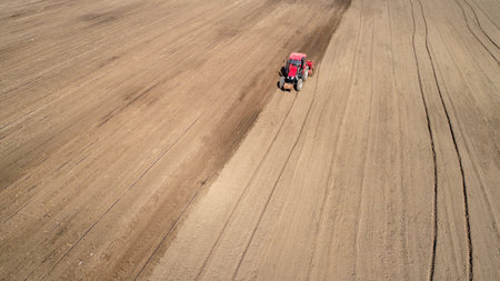 Rotary tiller planters grow peas on farms, Luannan County, Hebei Province, China