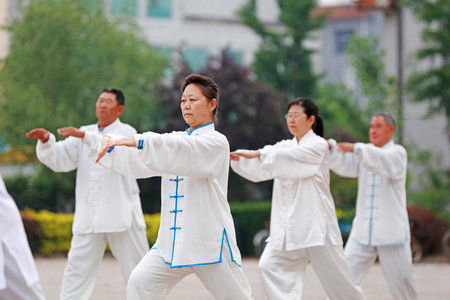 Luannan County-May 19, 2019: people doing traditional Tai Chi Chuan in the park for healthy, traditional Chinese martial arts concept, Luannan County, Hebei Province, Chinaのeditorial素材