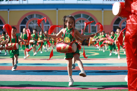 Luannan County-May 31, 2019: Children waist drum performance to celebrate International Children's Day, Luannan County, Hebei Province, Chinaのeditorial素材