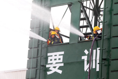 Luannan County, China-July 9, 2019: Firefighters are undergoing fire training, Luannan County, Hebei Province, Chinaのeditorial素材