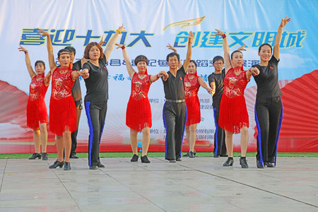 LUANNAN COUNTY, China-September 19, 2017: Sports dance performance in the outdoor square, LUANNAN COUNTY, Hebei Province, Chinaのeditorial素材