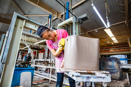 Luannan County-May 8, 2019: workers were busy in the production workshop in a ceramics factory, Luannan County, Hebei Province, China.のeditorial素材