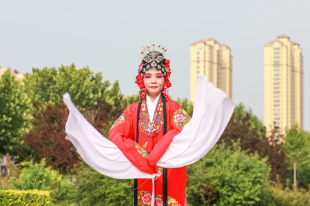 Luannan County, China-June 26, 2019: Peking Opera performers rehearse in the park, Luannan County, Hebei Province, Chinaのeditorial素材