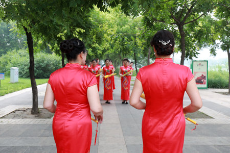 Luannan County, China-July 9, 2019: Chinese Cheongsam Walking Show in the Park, Luannan County, Hebei Province, Chinaのeditorial素材