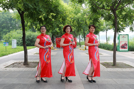 Luannan County, China-July 9, 2019: Chinese Cheongsam Walking Show in the Park, Luannan County, Hebei Province, Chinaのeditorial素材