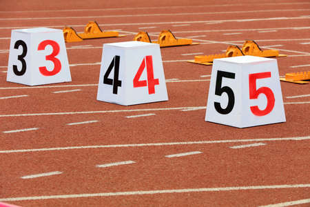 Track numbers and starters on the plastic track on the playground