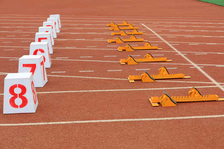 Track numbers and starters on the plastic track on the playground