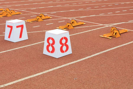 Track numbers and starters on the plastic track on the playground