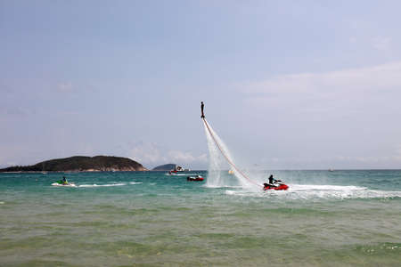 Sanya City, China-April 1, 2019: Water flying man amusement project in Yalong Bay, Sanya City,...