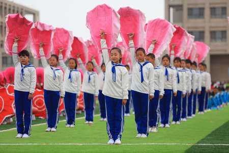 LUANNAN COUNTY, China-April 11, 2019: Group gymnastics performance at the opening ceremony of the Games, LUANNAN COUNTY, Hebei Province, Chinaのeditorial素材