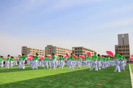 LUANNAN COUNTY, China-April 8, 2019: Group gymnastics performance at the opening ceremony of the Games, LUANNAN COUNTY, Hebei Province, Chinaのeditorial素材