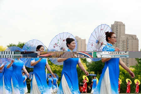 LUANNAN COUNTY, China-June 9, 2018: Women in cheongsam perform in the park, LUANNAN COUNTY, Hebei...
