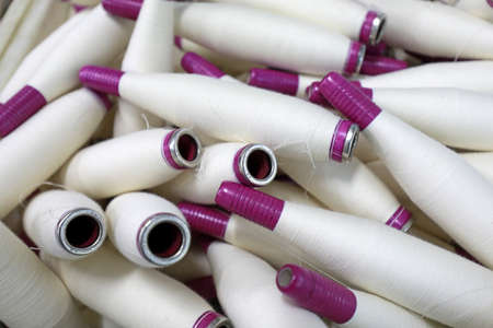 Cotton yarn is piled up in a spinning millの写真素材