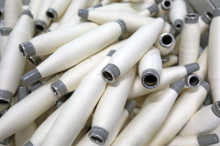 Cotton yarn is piled up in a spinning millの写真素材