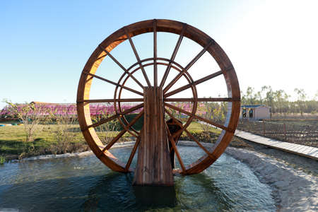 Wooden waterwheel architecture landscape in the parkの写真素材