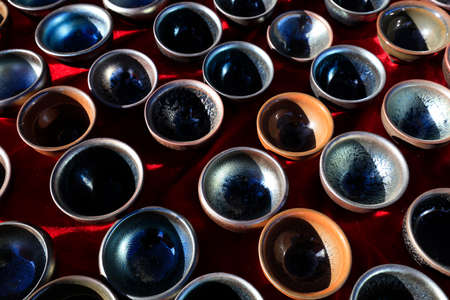Chinese ceramic teacups piled togetherの写真素材