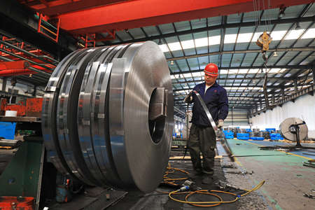 LUANNAN COUNTY, Hebei Province, China-March 25, 2020: Workers are busy on the strip production line...