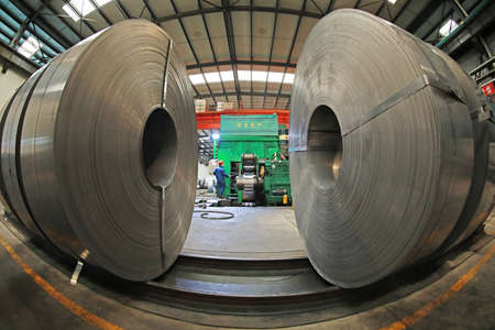 LUANNAN COUNTY, Hebei Province, China-March 26, 2020: Workers are busy on the strip production line in an iron and steel company.のeditorial素材