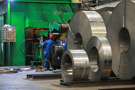 LUANNAN COUNTY, Hebei Province, China-March 26, 2020: Workers are busy on the strip production line in an iron and steel company.のeditorial素材