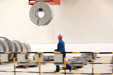 LUANNAN COUNTY, Hebei Province, China-March 26, 2020: Workers are busy on the strip production line in an iron and steel company.のeditorial素材
