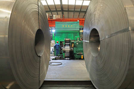 LUANNAN COUNTY, Hebei Province, China-March 26, 2020: Workers are busy on the strip production line in an iron and steel company.のeditorial素材