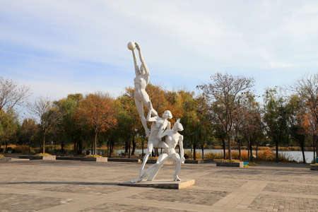LUANNAN COUNTY, Hebei Province, China-November 1, 2019: Volleyball players are sculpted in the park.のeditorial素材