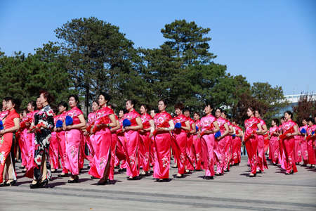 Tangshan City, China-October 7, 2018: Women's cheongsam show in the park, Tangshan City, Hebei Province, Chinaのeditorial素材