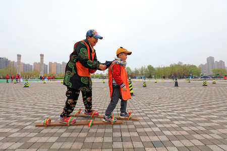 LUANNAN COUNTY, Hebei Province, China-April 20, 2019: Tourists play games in the park.