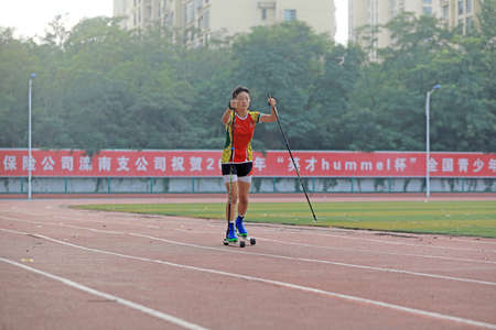 LUANNAN COUNTY, Hebei Province, China-August 14, 2020: A girl is practicing roller skating on the playgroundのeditorial素材
