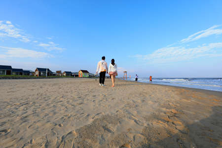 Leting County, Hebei Province, China-September 13, 2020: Tourists are playing on the beachのeditorial素材