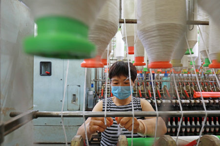 LUANNAN COUNTY, Hebei Province, China-July 17, 2020: The workers are busy on the production line in...