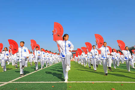 LUANNAN COUNTY, Hebei Province, China-September 30, 2020: Middle school students practice Taiji Fan...