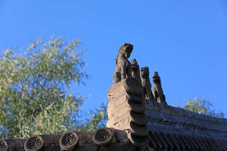 Ancient brick carving works in the background of blue sky, North China
