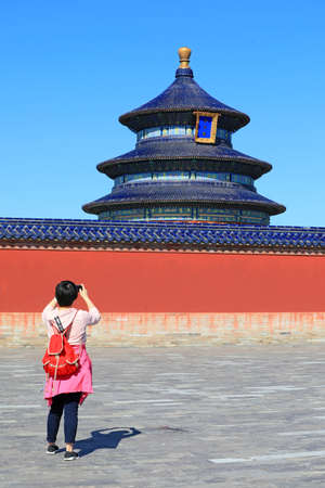 Beijing, China-October 5, 2020: Female tourists play in the classical architecture of the temple of heaven in Beijingのeditorial素材