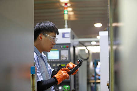 LUANNAN COUNTY, Hebei Province, China-September 29, 2020: Workers work hard on the production line of automobile safety systemのeditorial素材