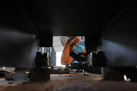 LUANNAN COUNTY, Hebei Province, China-July 10, 2020: workers work in a factory on a production lineのeditorial素材