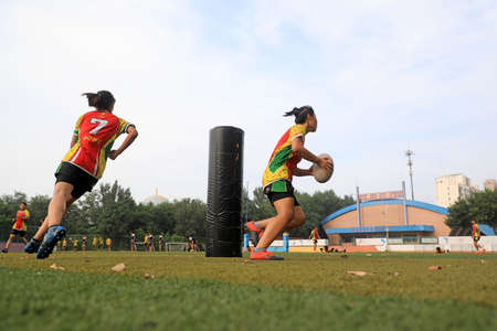 LUANNAN COUNTY, Hebei Province, China-August 14, 2020: The students are practicing Rugby on the playgroundのeditorial素材