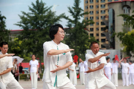 LUANNAN COUNTY, Hebei Province, China-August 8, 2020: People are practicing Taijiquan in the squareのeditorial素材