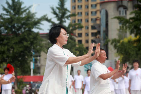 LUANNAN COUNTY, Hebei Province, China-August 8, 2020: People are practicing Taijiquan in the squareのeditorial素材