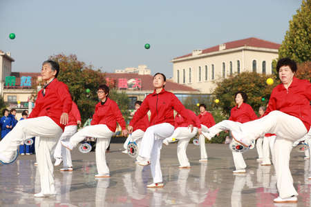 LUANNAN COUNTY, Hebei Province, China-October 18, 2020: Ladies are practicing Tai Chi softball in the squareのeditorial素材