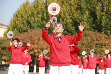 LUANNAN COUNTY, Hebei Province, China-October 18, 2020: Ladies are practicing Tai Chi softball in the squareのeditorial素材